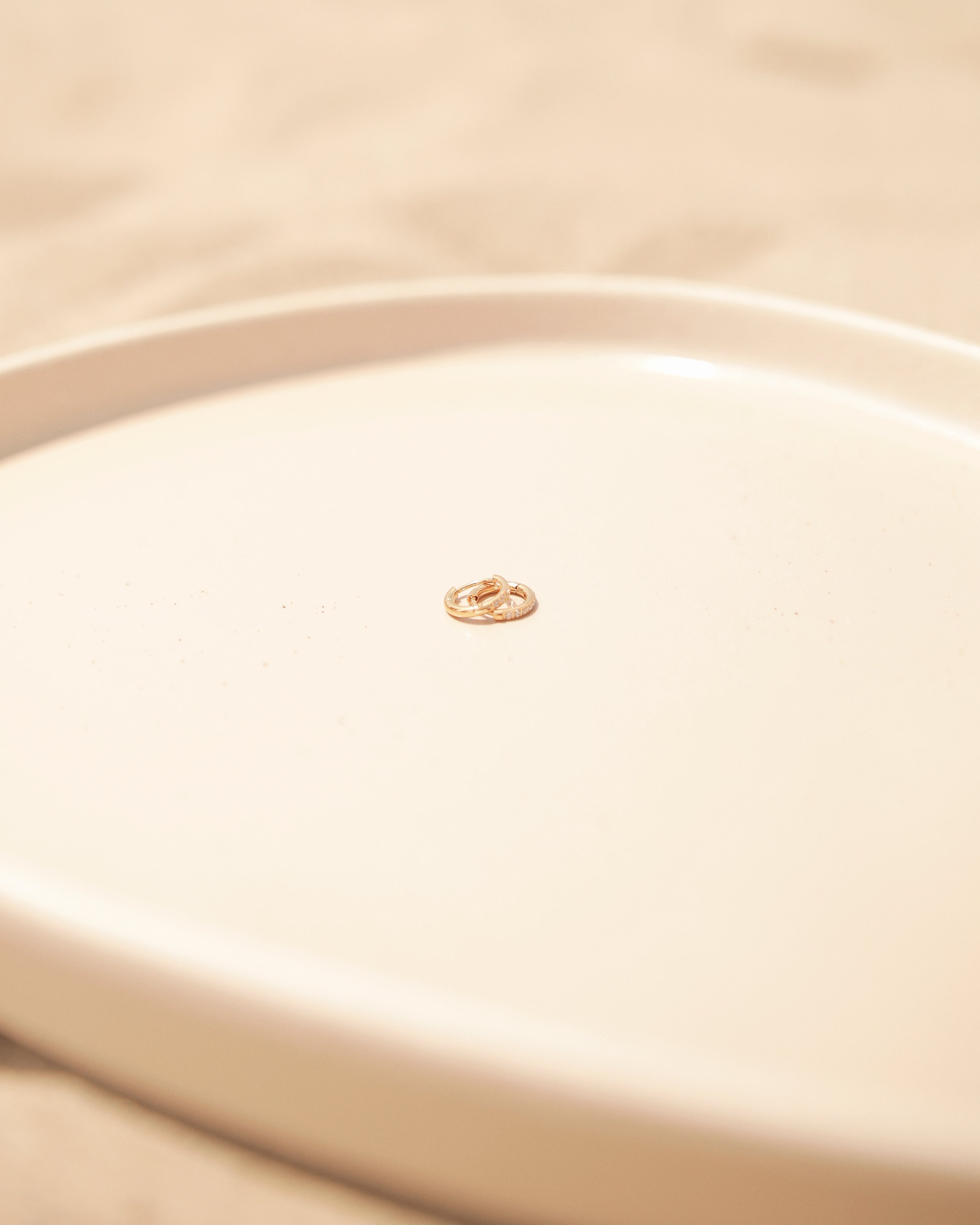 Close-up of a beige fabric with water-resistant Shine Hoop Rings